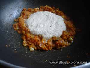adding coconut paste for poached egg curry recipe
