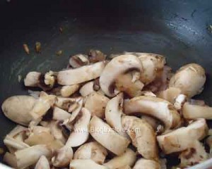adding button mushrooms for mushroom peas stir fry